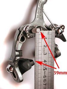 This caliper has a reach range of 39-49 mm. As shown, with the brake shoe adjusted all the way up, it measures 39 mm from the center of the bolt to the center of the brake pad.