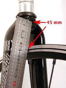 This fork and rim combination call for a brake caliper that can be adjusted to provide a 45 mm reach. The caliper shown would fit.